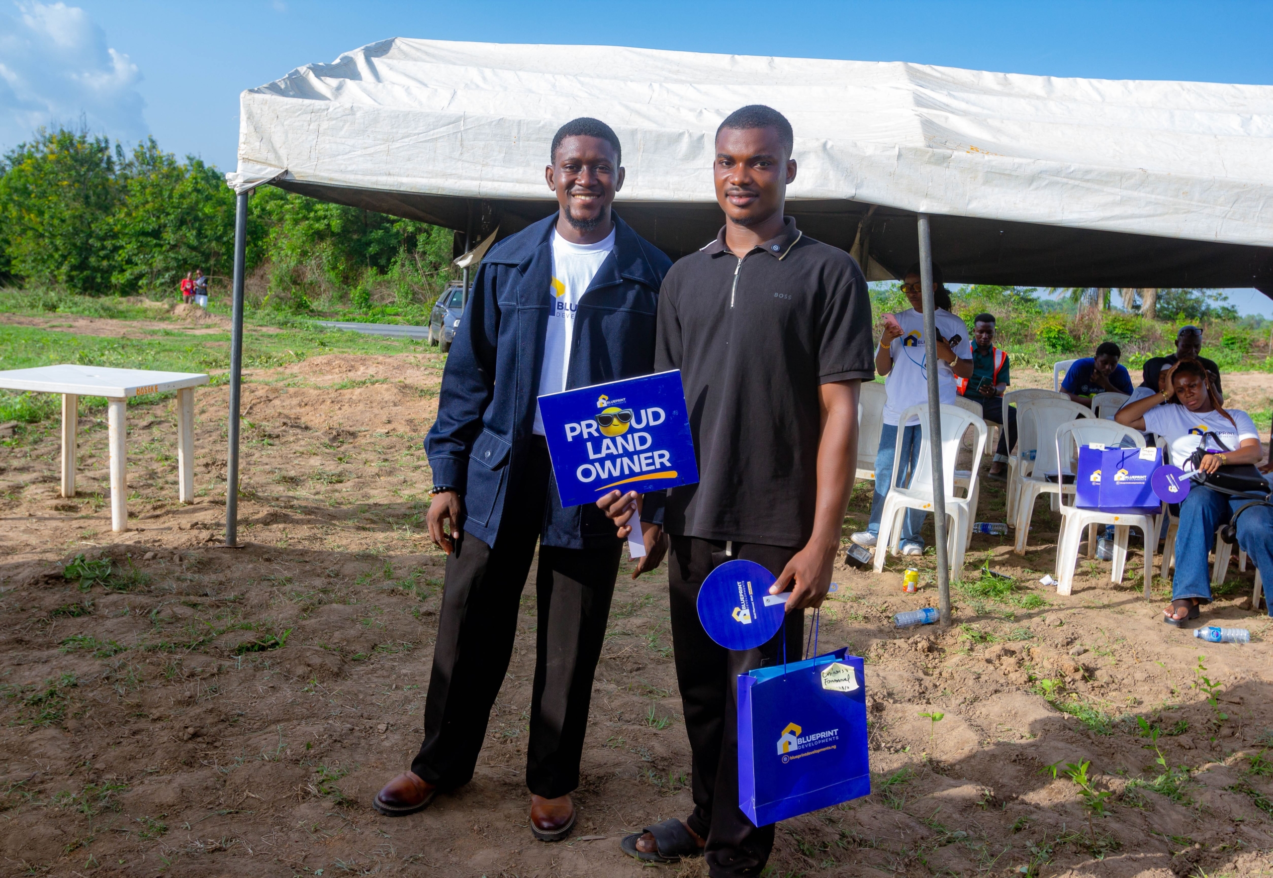 Awele Emmanuel with a client at Blueprint Developments land allocation